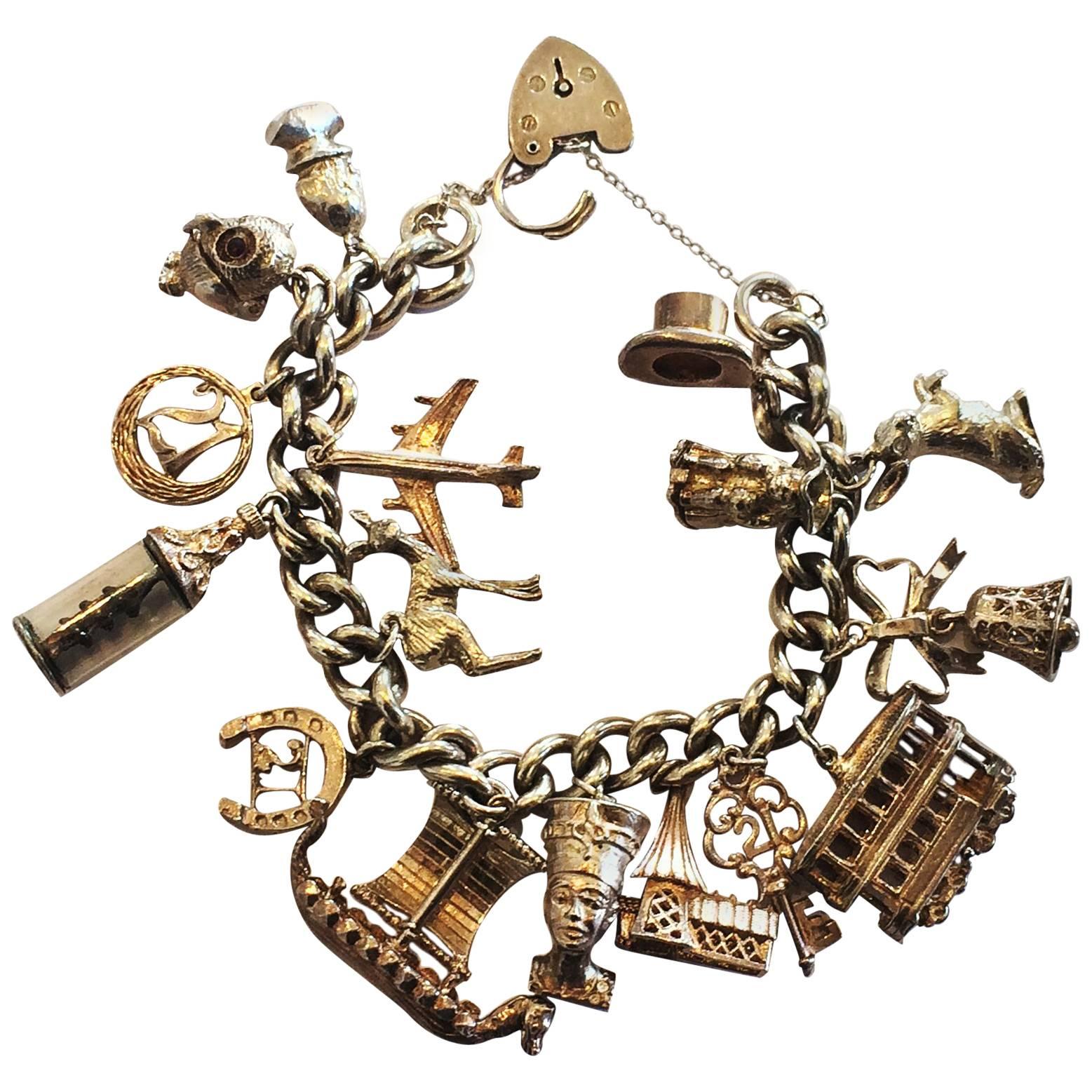 Vintage Sterling Silver loaded charm bracelet at 1stDibs
