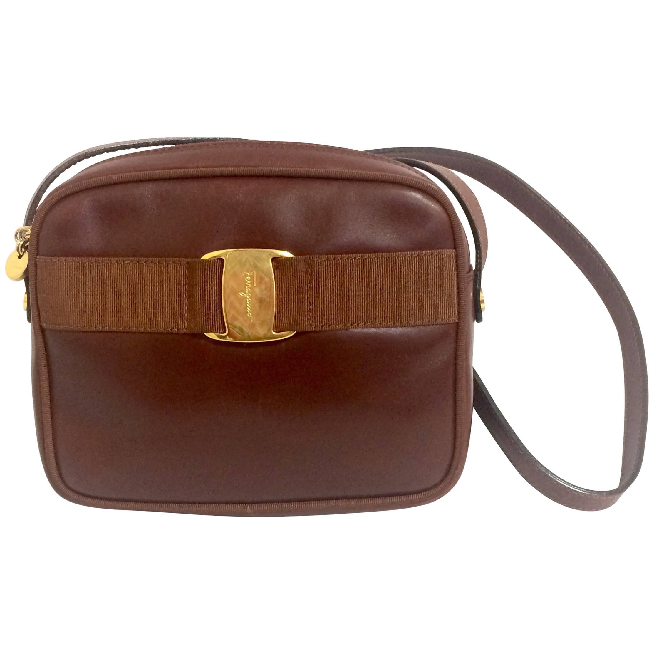 Vintage Salvatore Ferragamo vara collection brown leather purse with logo motif.