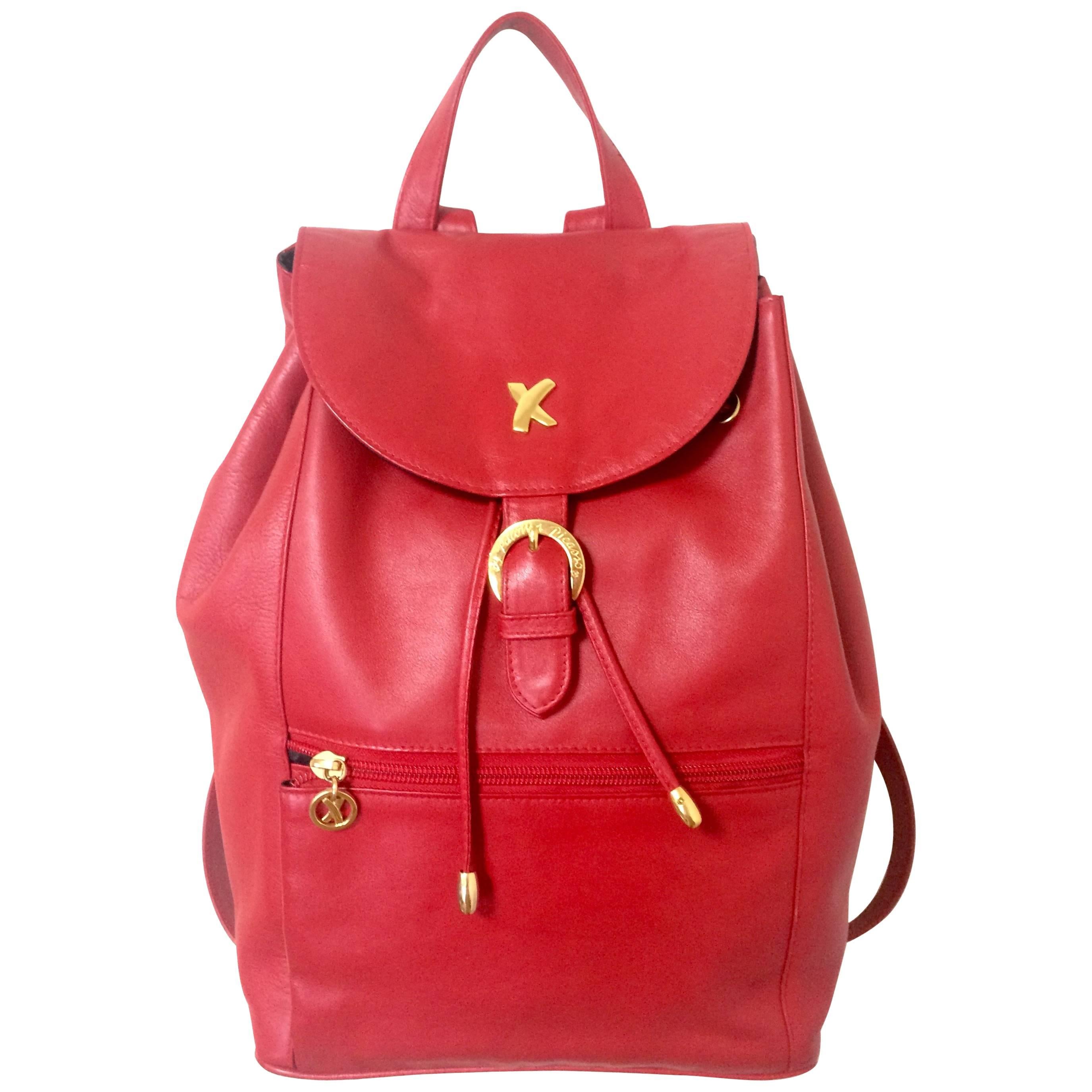 Vintage Paloma Picasso red leather backpack with golden logo motifs. Classic bag