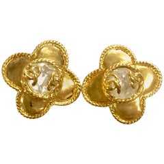 MINT. Vintage CHANEL golden flower design earrings with CC marks.