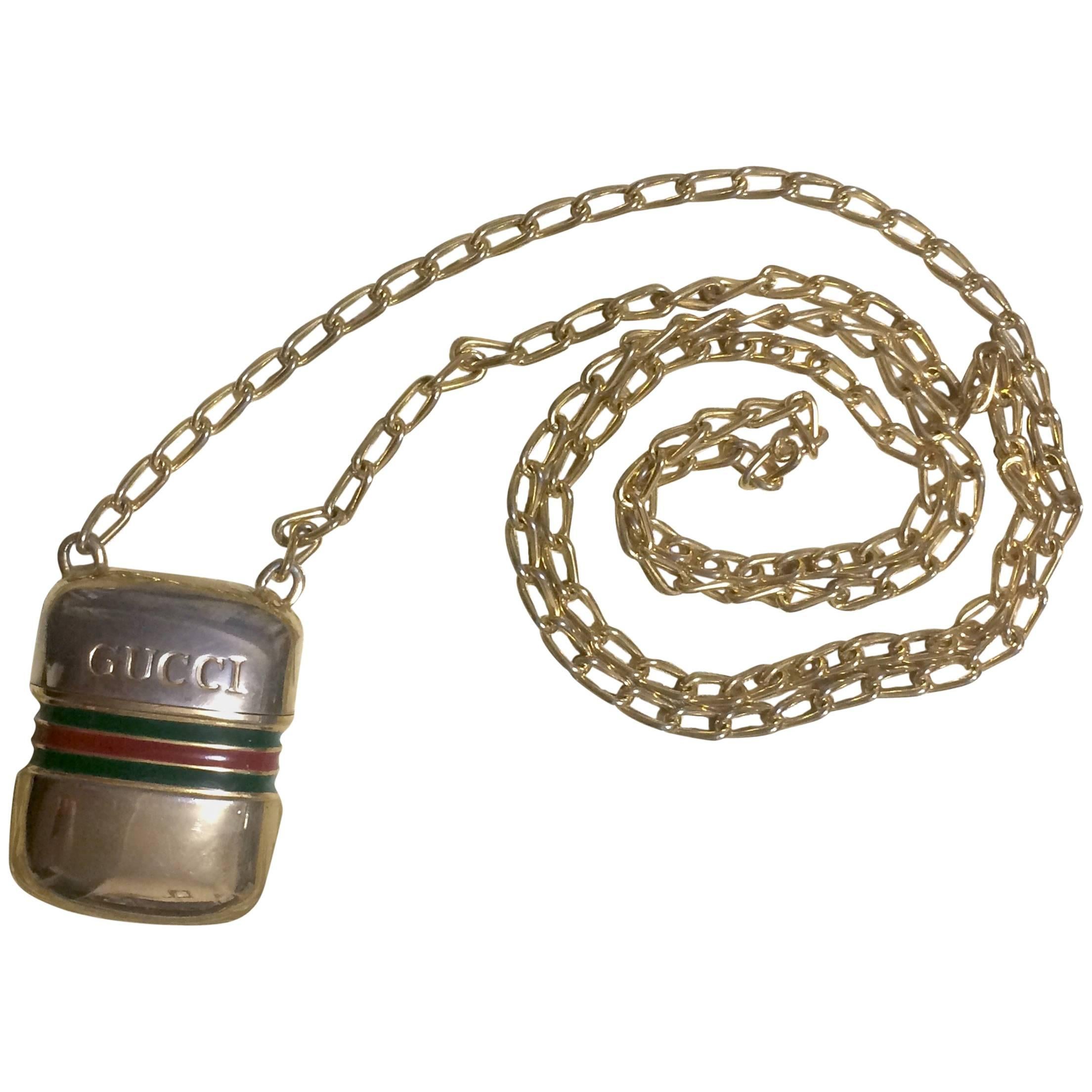 Vintage Gucci golden mini bottle, pill case design necklace with webbing line. For Sale