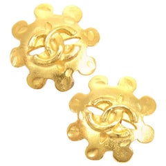 Chanel Gold Tone CC Logo Flower Motif Earrings