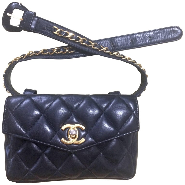 Vintage CHANEL black lamb waist bag, fanny pack with gold chain belt and CC  motif. at 1stDibs