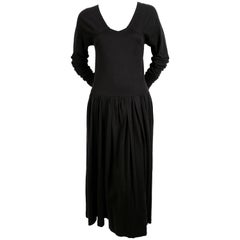 early 1980's COMME DES GARCONS black dress with open back and exaggerated arms