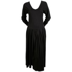 1985 COMME DES GARCONS black runway dress with open back and exaggerated arms