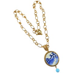 Victorian ceramic pendant and a bronze chain