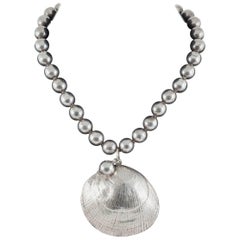 Sterling silver hand wrought 'clam shell' and hollow ball necklace, Mexican..