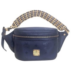 Used MCM black monogram fanny pack with golden chain belt. By Michael Cromer