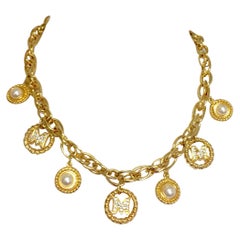 Vintage Moschino statement necklace with golden dangling charms with faux pearls