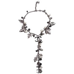 CHANEL Necklace in Ruthénium Metal with Charms and Pearls