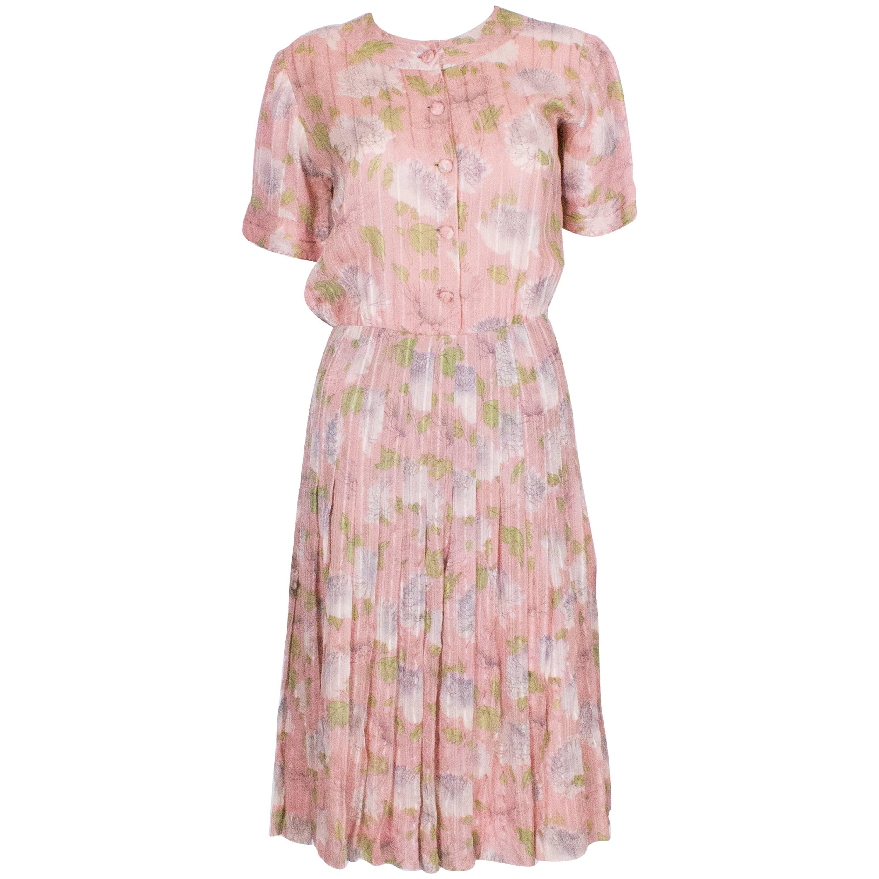 A vintage 1940s floral print, pink summer cotton day dress