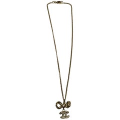 Chanel Necklace - Gold Tone Metal - Bow with CC Logo Charm