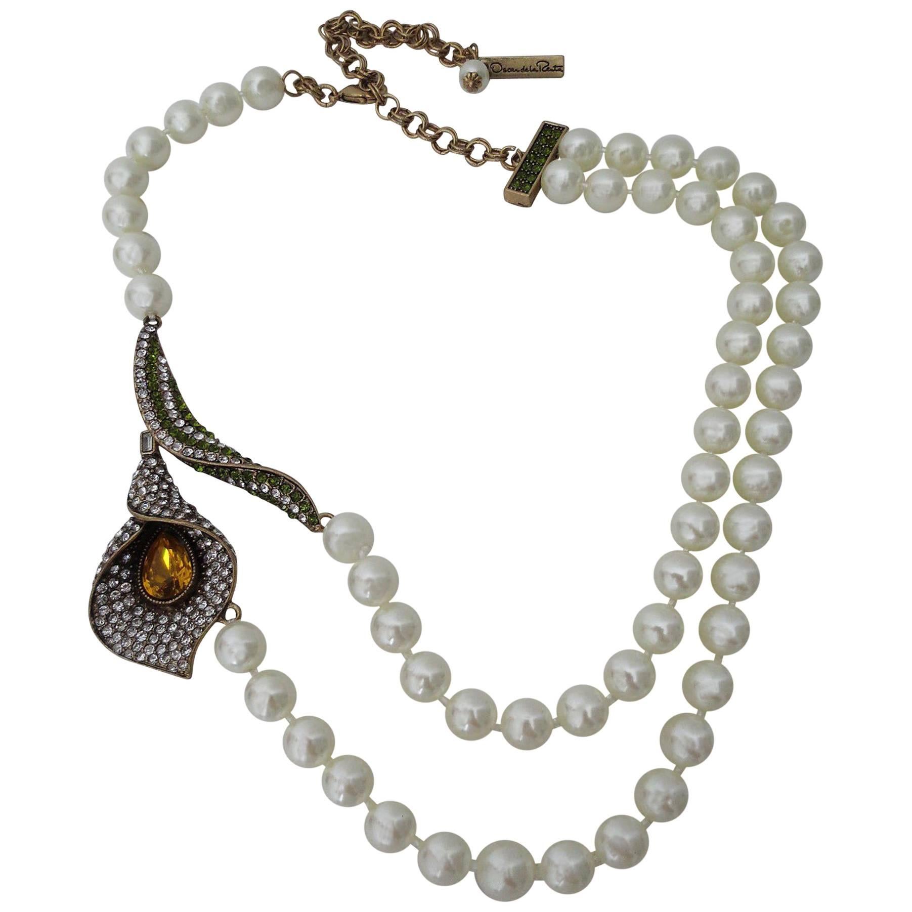Stunning signed Oscar de la Renta Designer faux Pearl and encrusted Jeweled Calla LilyStatement Necklace. Necklace approx. 21 in; long; Lily 2.2 in; x 2.5 in wide; Awesome and Fabulous as you are! 
