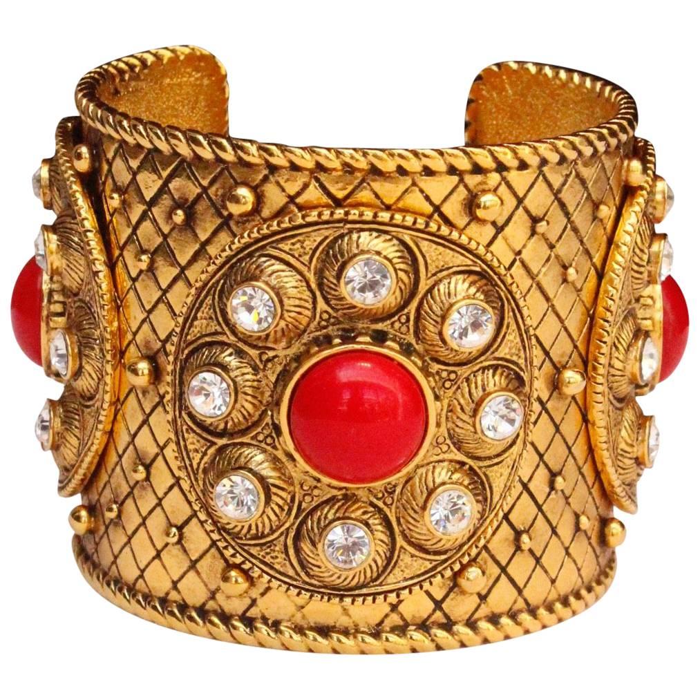 1990s Christian Dior gilded metal cuff with rhinestones and red cabochons For Sale