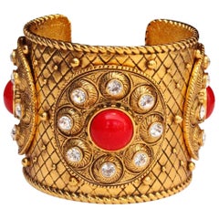 Retro 1990s Christian Dior gilded metal cuff with rhinestones and red cabochons