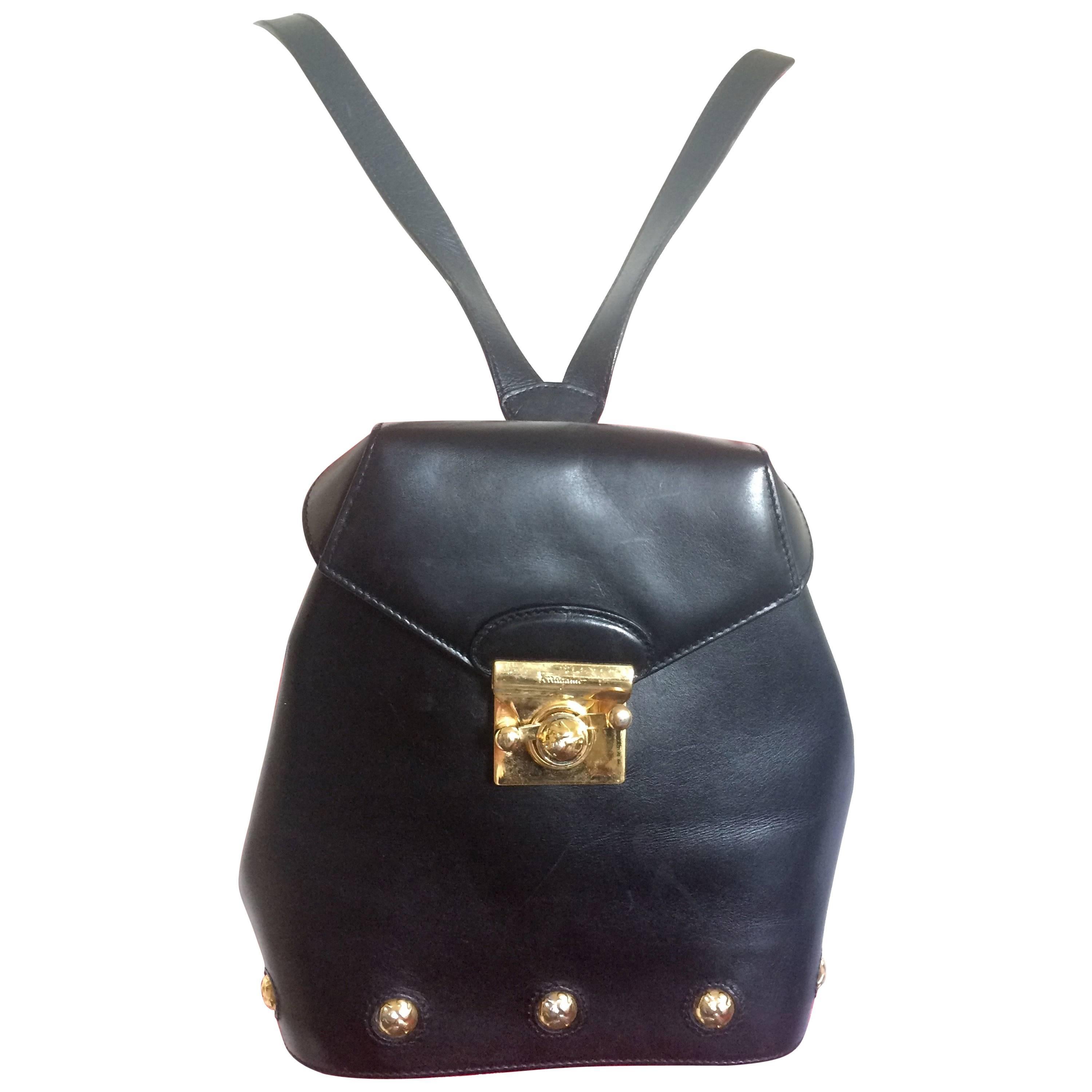 Vintage Salvatore Ferragamo black calf leather backpack with golden motif
