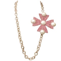 1980s, Yves Saint Laurent long necklace with a pink rhisnestone pendant cross 