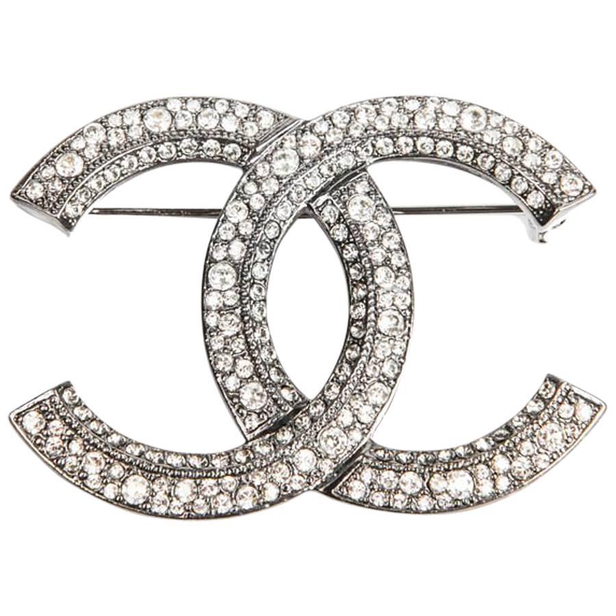 CHANEL Double C Brooch in Silver Plated Metal and Rhinestones