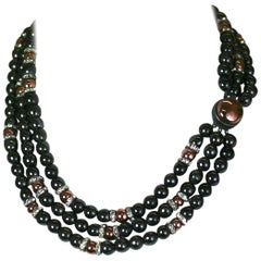 Collier Louis Rousselet en hématite et verre cuivré.