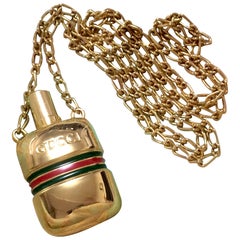 MINT. Retro Gucci golden mini perfume bottle necklace with webbing line.