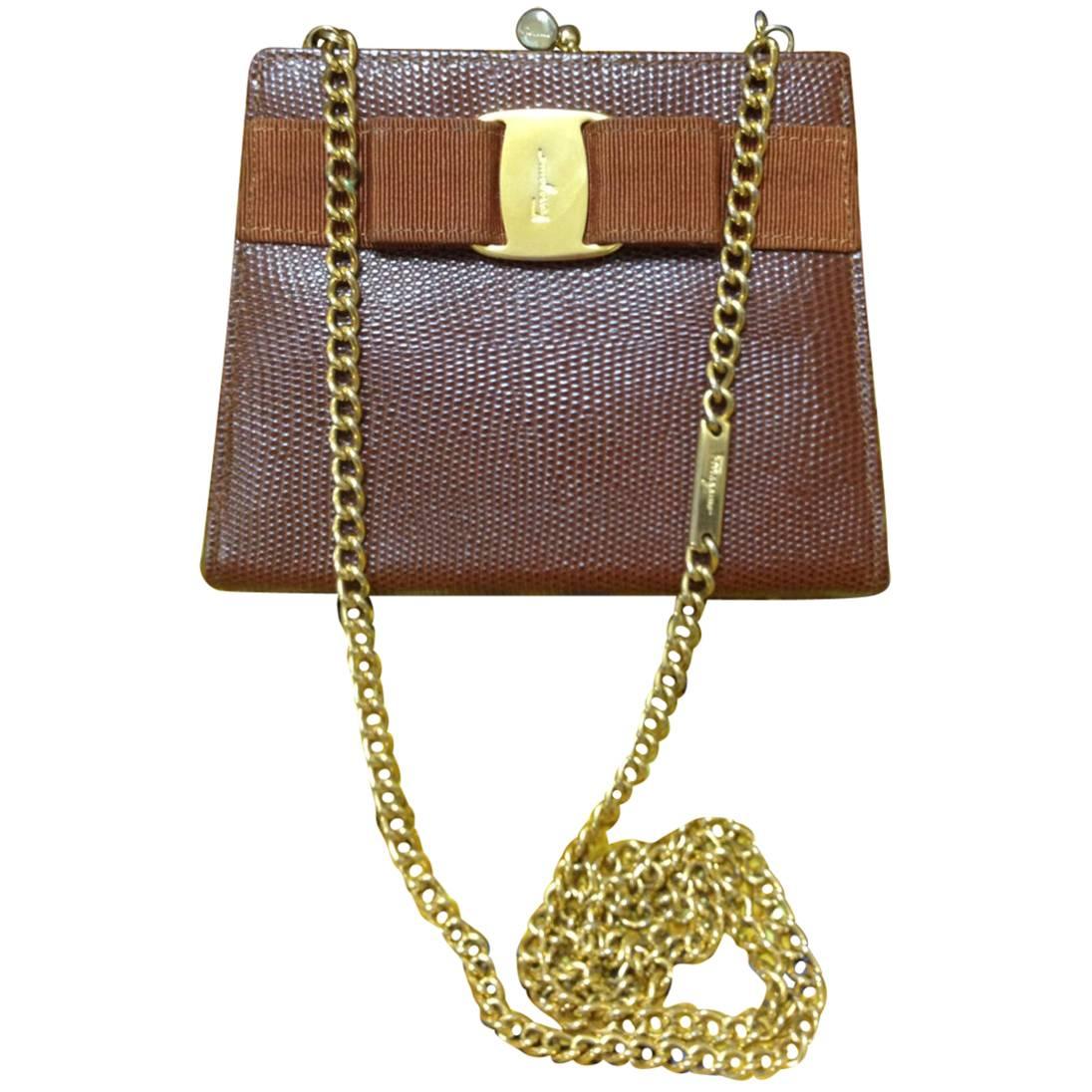 Vintage Salvatore Ferragamo brown lizard embossed leather golden chain clutch. For Sale