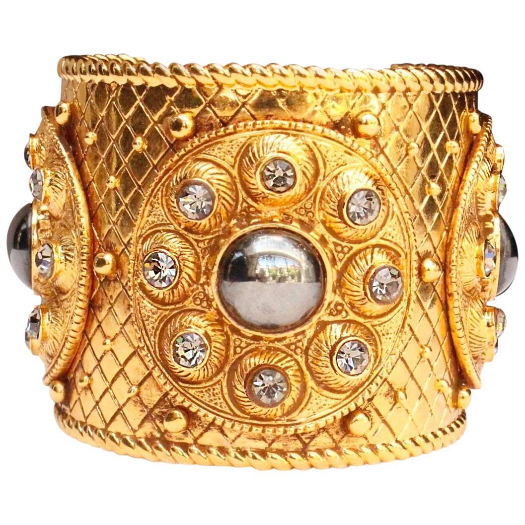 1990s Christian Dior gilded metal cuff bracelet with rhinestones and cabochons For Sale