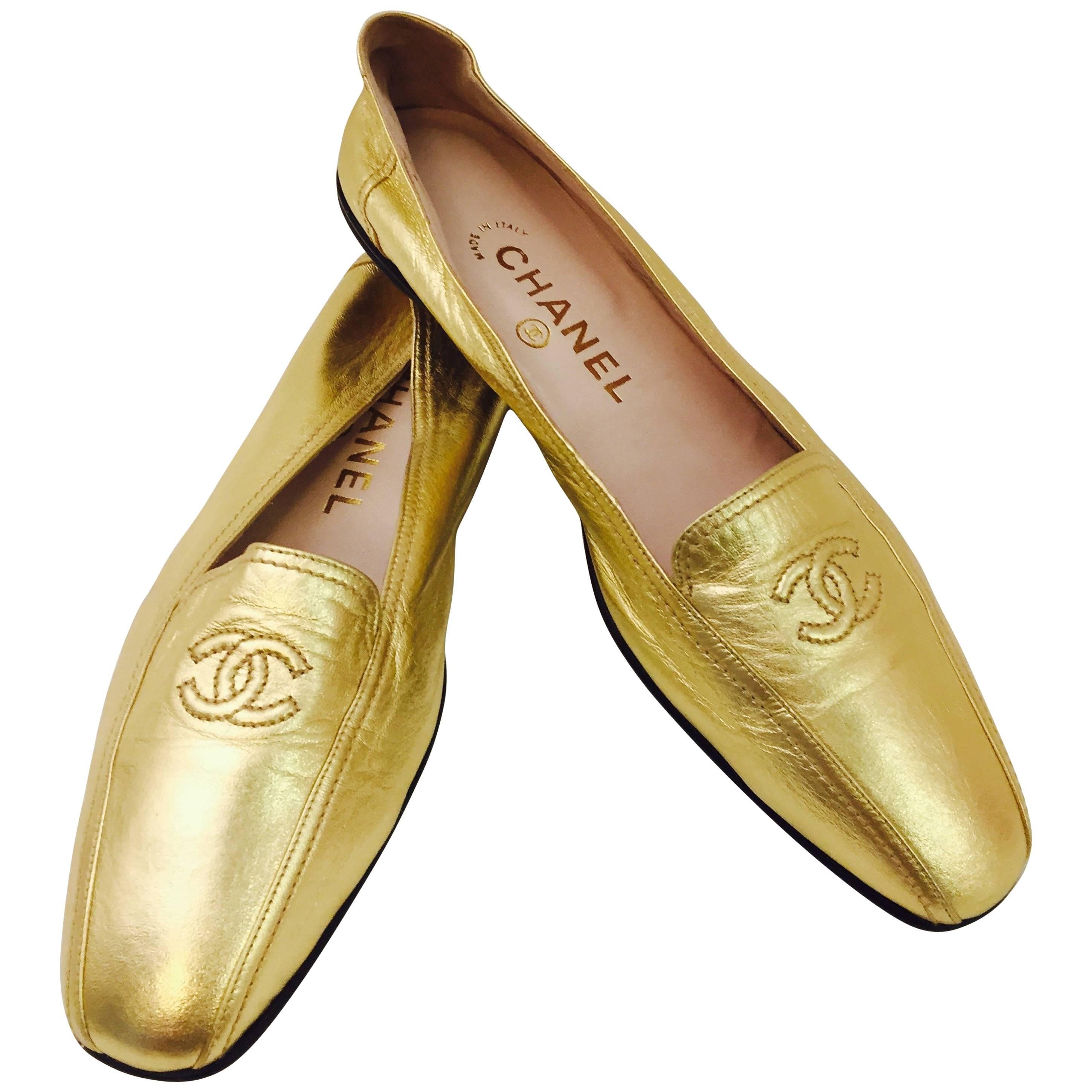 Shimmering Chanel's Metallic Gold Lambskin Loafers with CC Logo At Top 