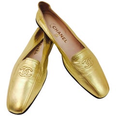 Shimmering Chanel's Metallic Gold Lambskin Loafers with CC Logo At Top 