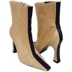 Mod Chanel Black and Tan Ankle Boots With Sculpted Heels and Cap Toes