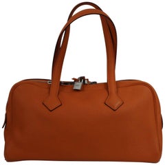 2011 Hermes Victoria Bag in Orange Clemence Taurillon Grained Leather.
