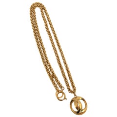 1980s Chanel Gold Tone Necklace with 3D Orb Monogram Double C Pendant