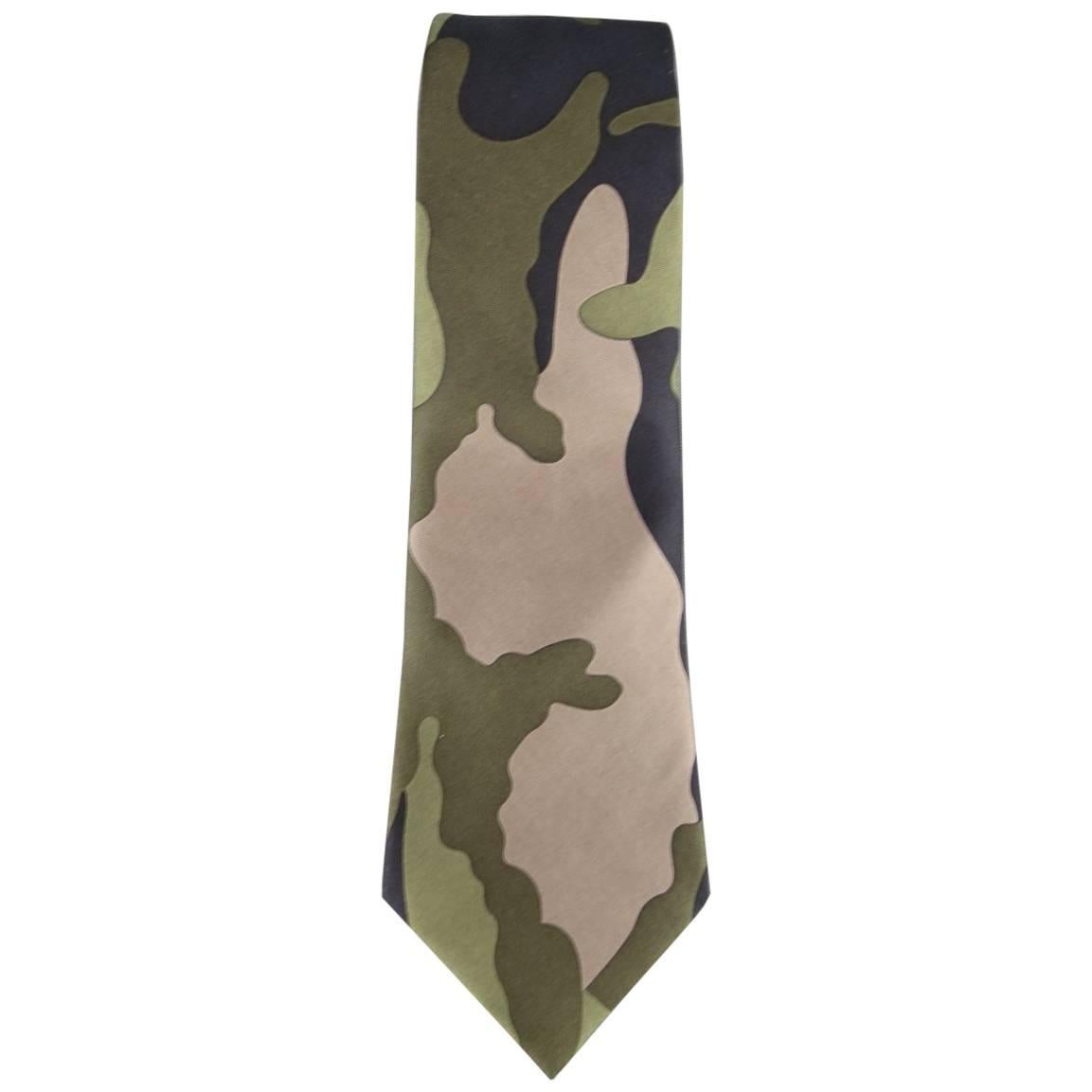 VALENTINO dress tie comes in large scale camouflage print with hues of olive gre