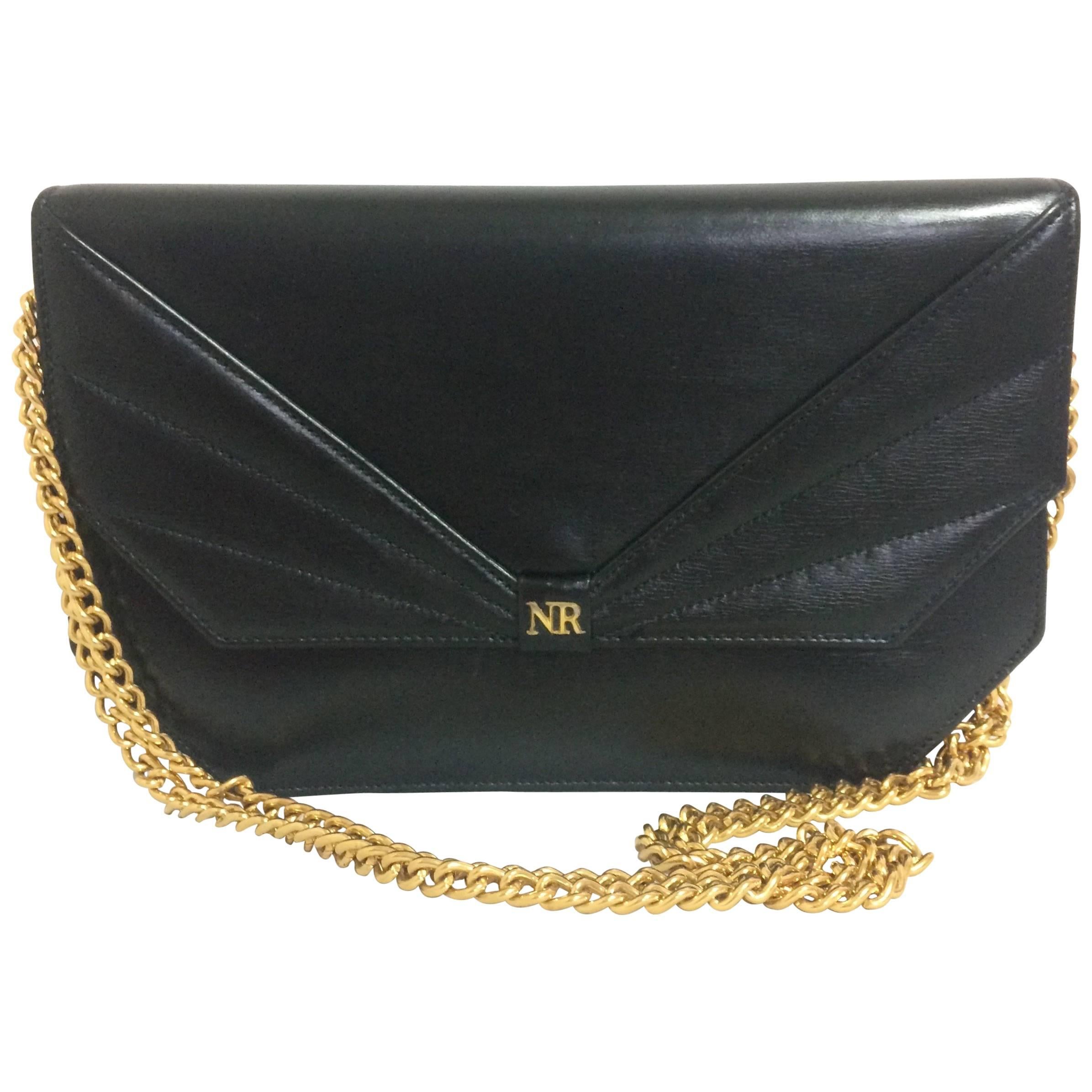 Vintage Nina Ricci black leather chain clutch shoulder bag with a bow stitch For Sale