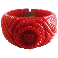 Antique Art Deco heavily carved red clamper hinged bangle bracelet