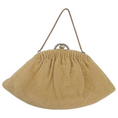 Goldfarbene Abendtasche mit Perlen
