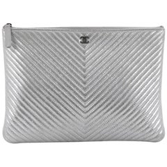 Chanel O Case Clutch Chevron Lambskin Medium