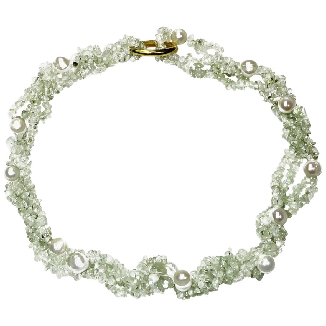38 Inch Infinity Necklace of Lovely Green Prehnite Chips in double rows secured with Freshwater Pearls.  The tumbled and polished Prehnite combines so well with freshwater pearls.  This necklace with enhance all your ensembles.  Gold tone and Silver