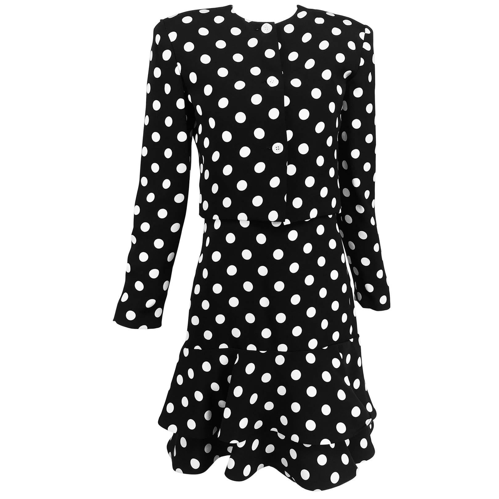 Carolyne Roehm black and white silk polka dot strapless dress and jacket fro the  1990s. Fitted torso boned strapless dress has a double ruffle hem and closes at the back with a zipper and hook and eye, fully lined. Matching cropped jacket closes at