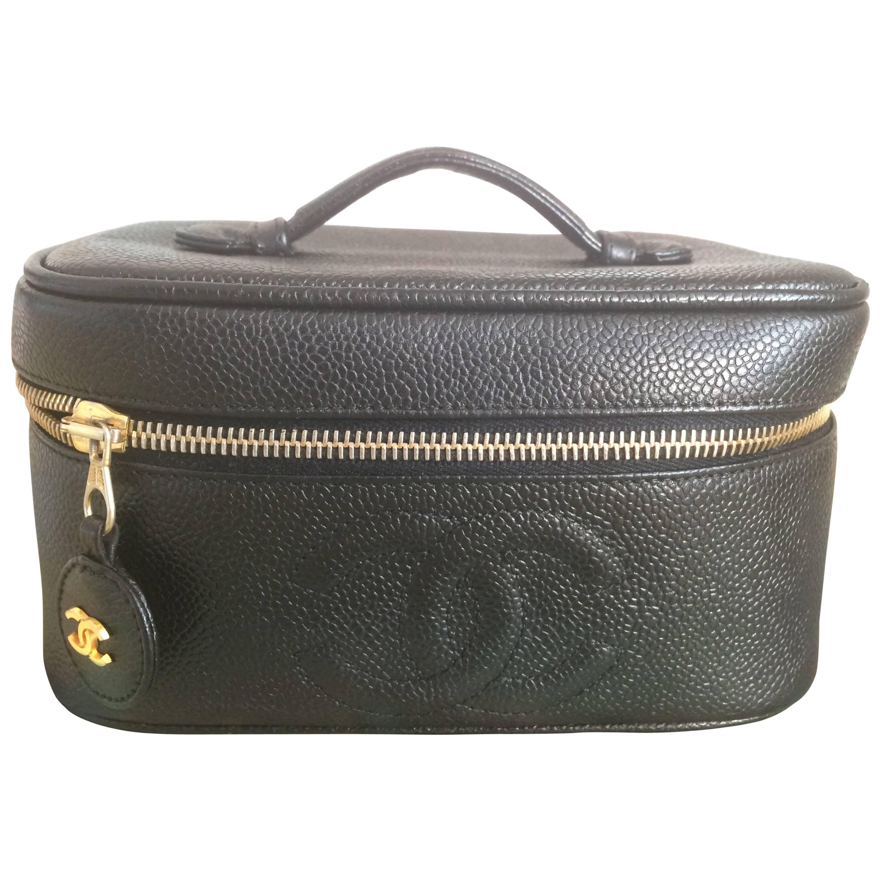 Vintage CHANEL black caviar cosmetic case, vanity bag, mini purse with CC mark.