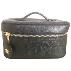 Retro CHANEL black caviar cosmetic case, vanity bag, mini purse with CC mark.