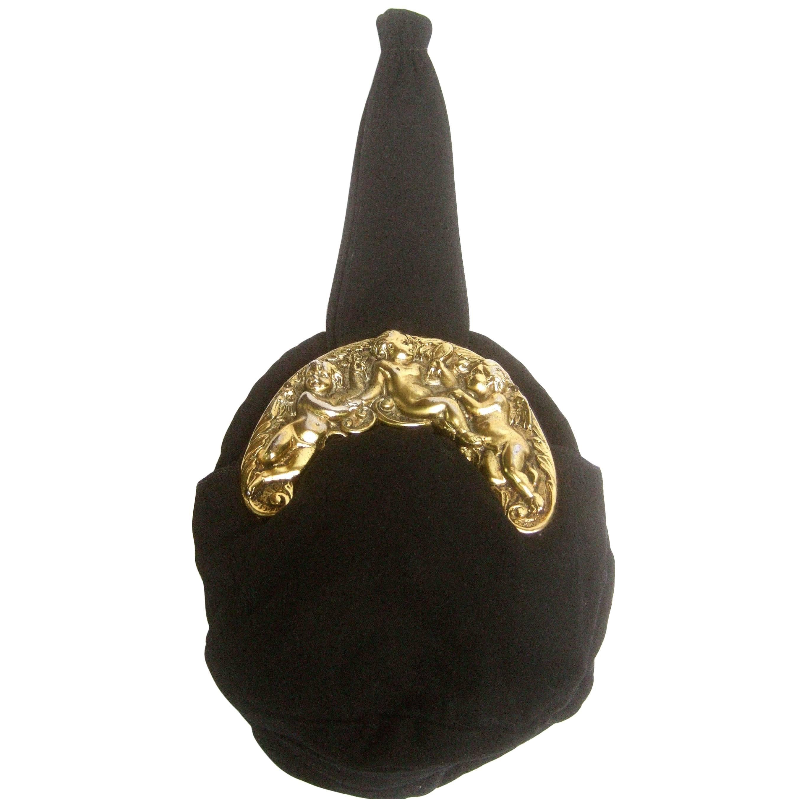 Ornate Brass Metal Cherub Emblem Black Cloth Evening Bag c 1950s For Sale