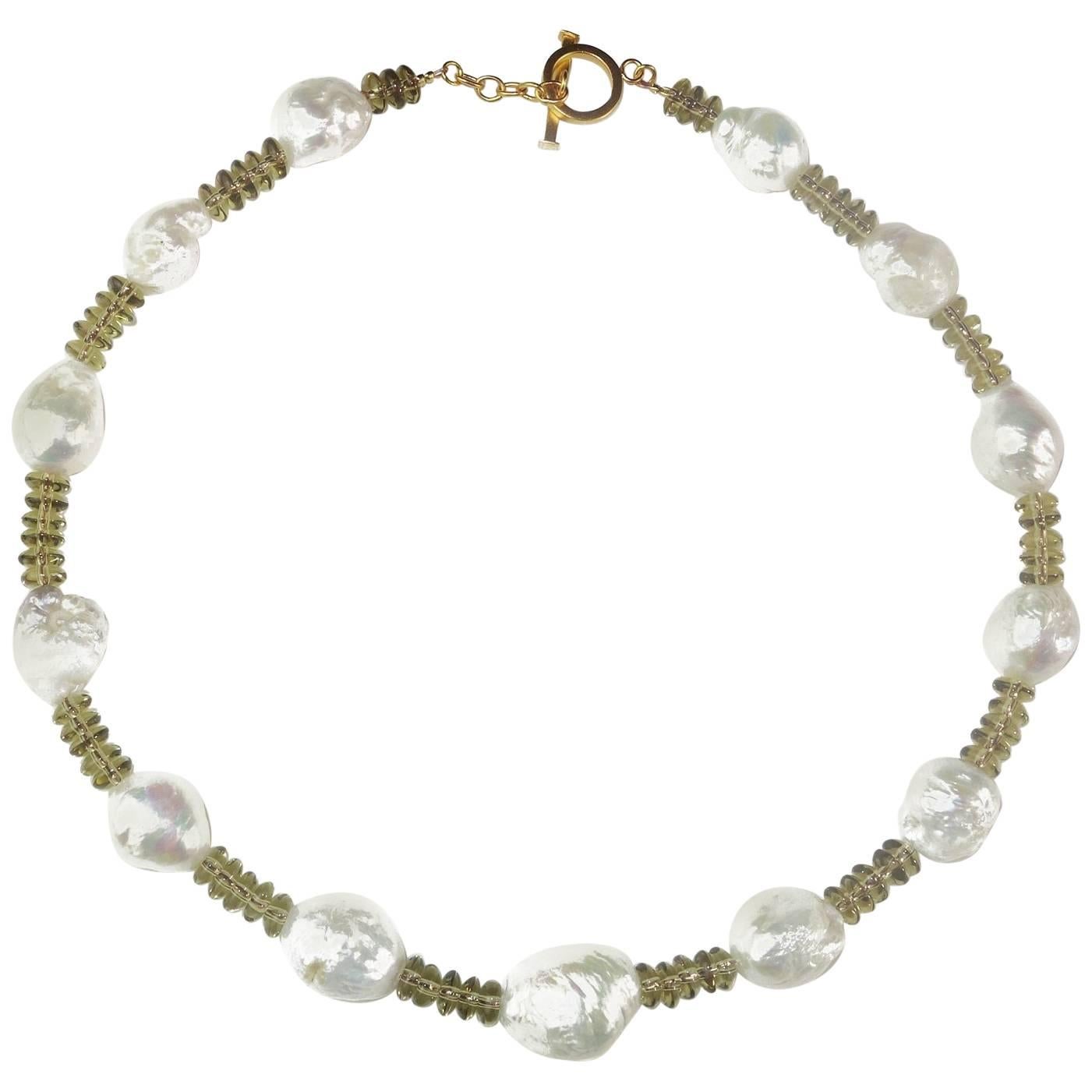 Transparent, sparkling Smoky Quartz and Iridescent White Pearl Necklace. The light Smoky Quartz rondels in this necklace are so bright and sparkling they balance the Baroque Pearls and accent the goldy flashes on the pearls. The Smoky Quartz rondels