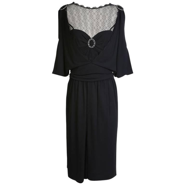 Chanel Black Dress with Mesh Neckline and Ring Medallion 