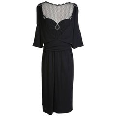Chanel Black Dress with Mesh Neckline and Ring Medallion