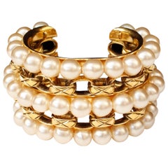 1990s Chanel cuff bracelet composed of pearly beads and gilt chain
