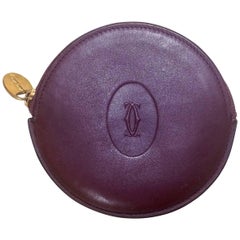 Retro Cartier genuine wine leather coin case with gold tone logo pull. Unisex