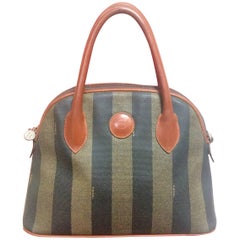 Vintage FENDI black and grey pecan stripe bolide shape bag with brown handles.