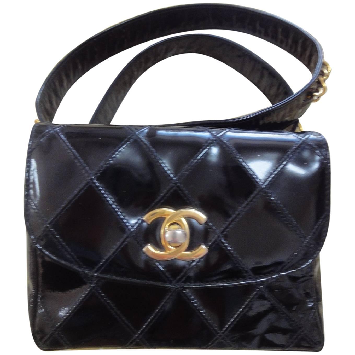 Vintage CHANEL black patent enamel waist purse, fanny pack with gold chain belt.