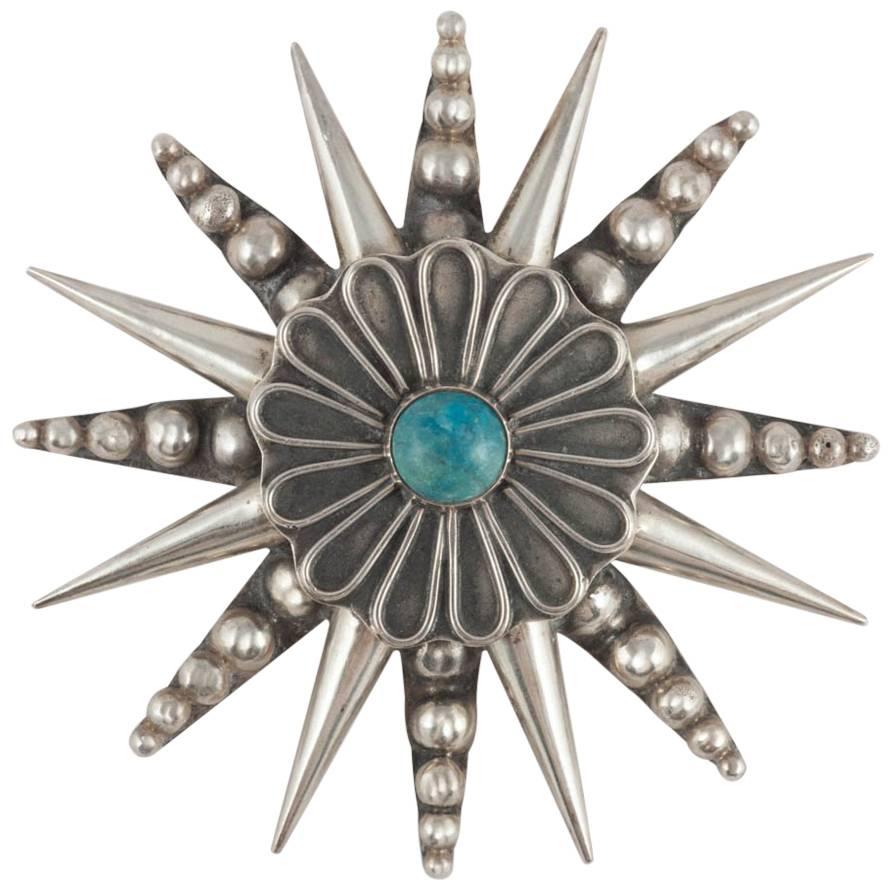  Mexican Sterling silver and turquoise 'star' pendant or brooch, 1950s