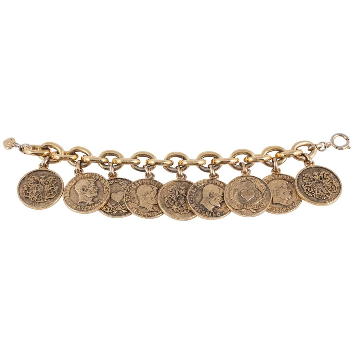  Early 'Cheap and Chic' antiqued gilt coins charm bracelet, Moschino, 1990s 